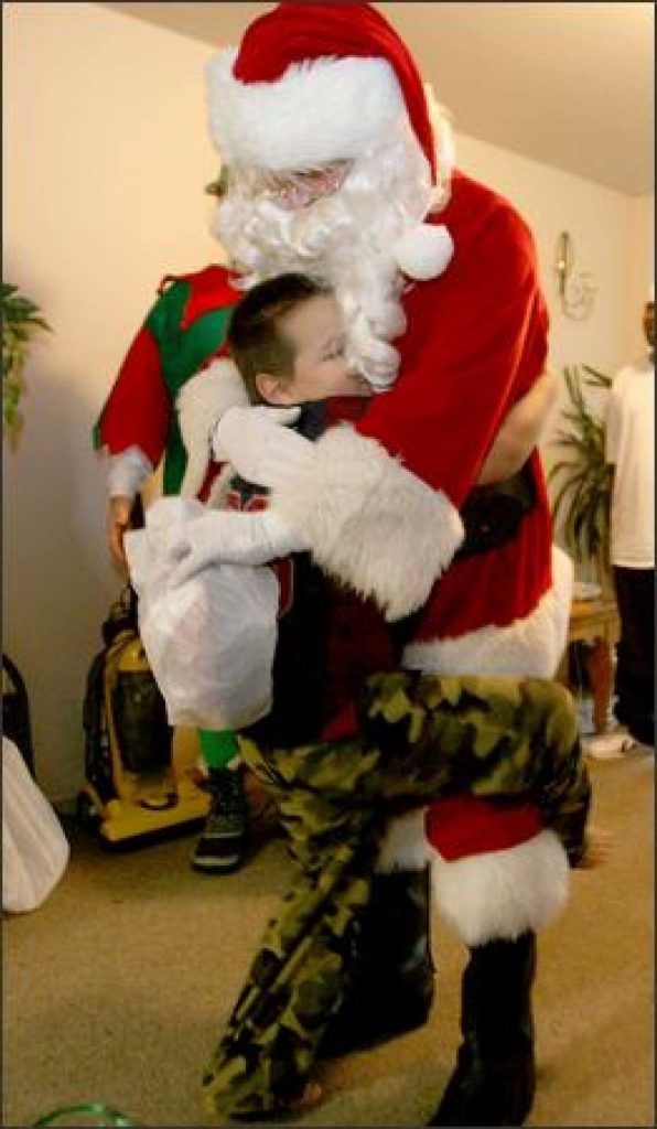 TCC Holiday Hugs program involves matching a family or child in need with a Secret Santa who is willing to sponsor them this holiday season. This is not a real picture of a TCC child but a representation of the spirit of giving that embodies the Holiday Hug Program.