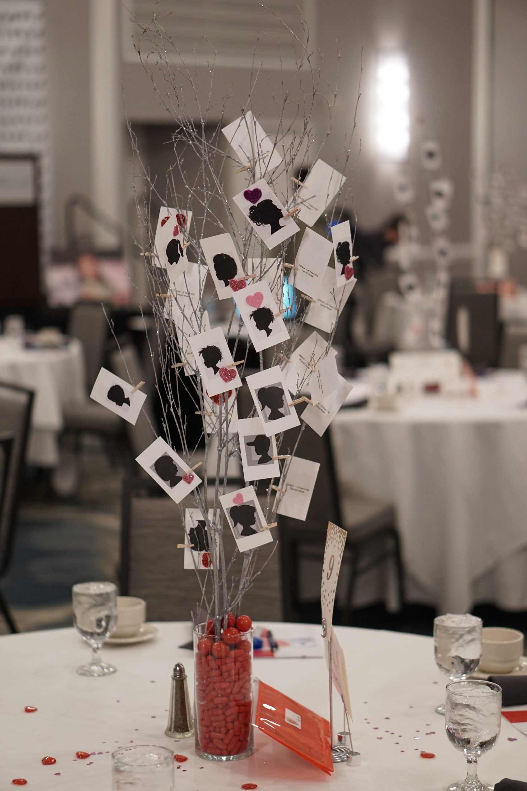 Centerpieces with Child Silhouettes representing all the children we served last year.